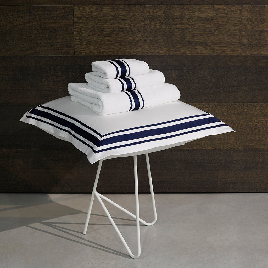 White towels with online blue trim